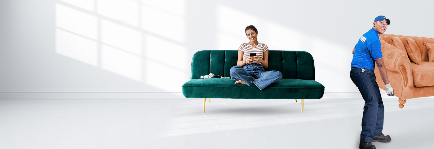 1-800-GOT-JUNK? removes couch as customer relaxes at home