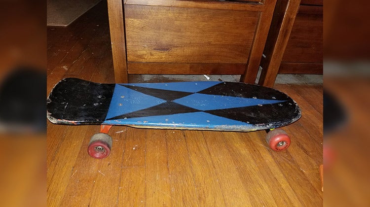 Small black and blue skateboard submitted by Charlotte