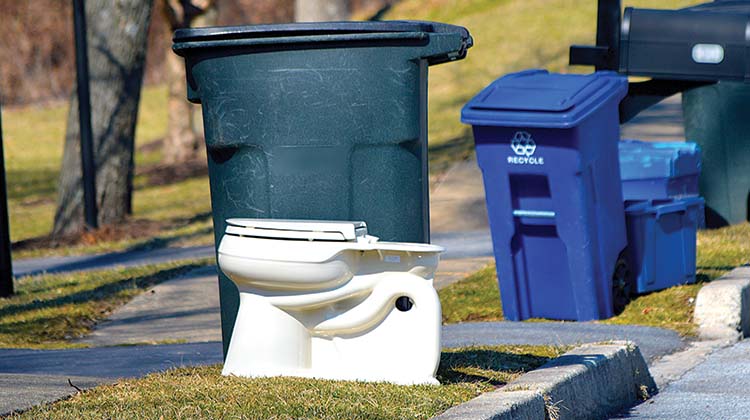 How to dispose of your old toilet An old toilet sitting at the curbside, ready to be picked up