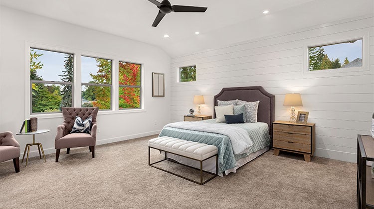 open bedroom with corner table and chairs