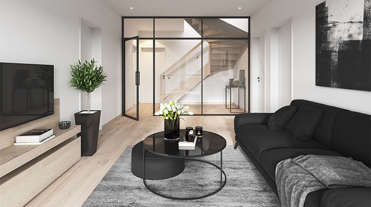 basement with black couch and large glass wall basement with black couch and large glass wall