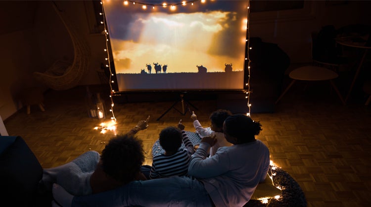 At-home movie night with projector and fairy lights 