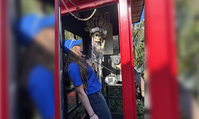 Spooky Junk - Phone Booth A 1-800-GOT-JUNK? Truck Team Member in a spooky phone booth.