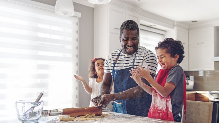 Family baking together in a clean kitchen Family baking together in a clean kitchen