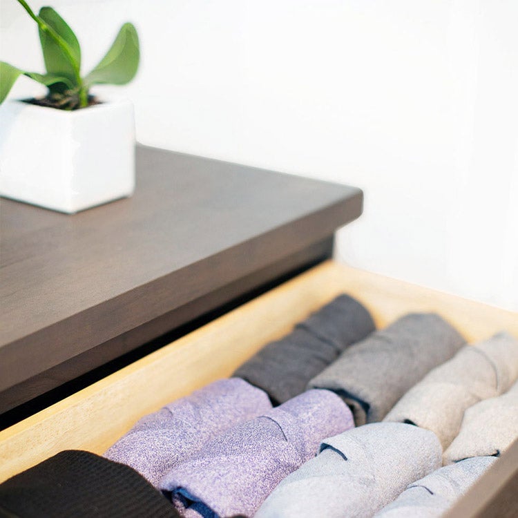 Folded shirts in a dresser drawer 