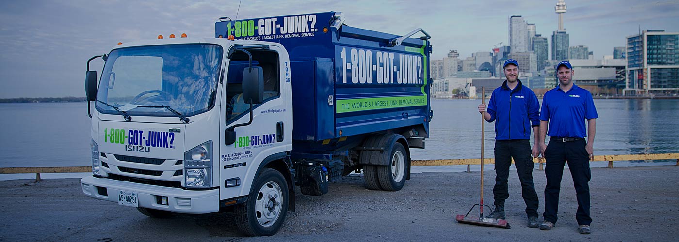 1-800-GOT-JUNK? Toronto team next to junk removal truck