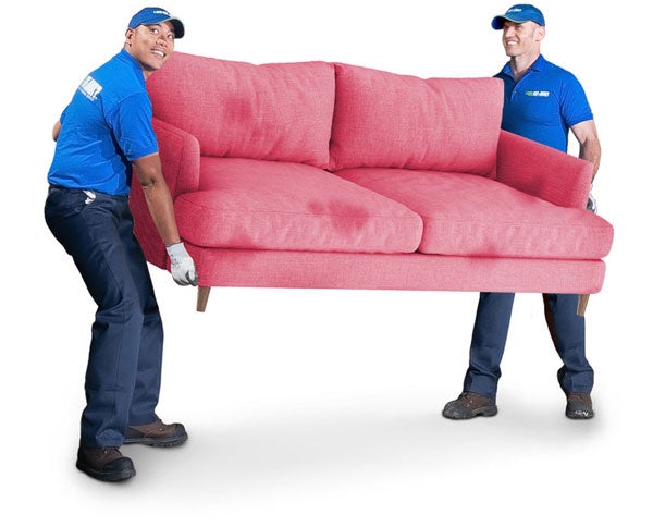 Two 1-800-GOT-JUNK? team members carrying a red sofa