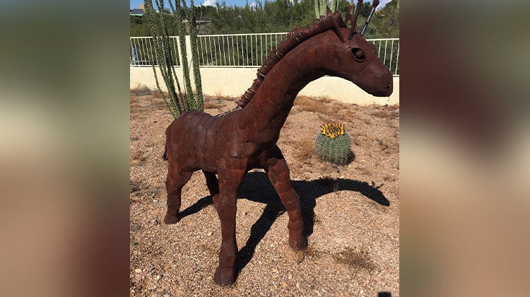 Metal horse/giraffe sculpture 