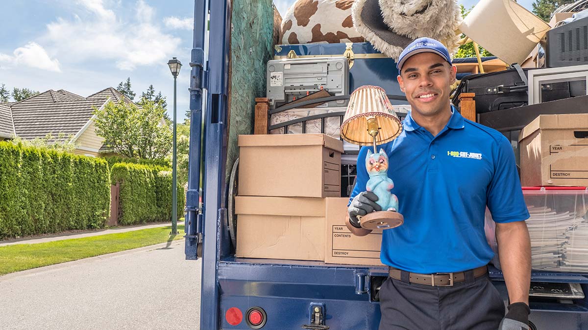 Truck Team Member holding a weird cat lamp